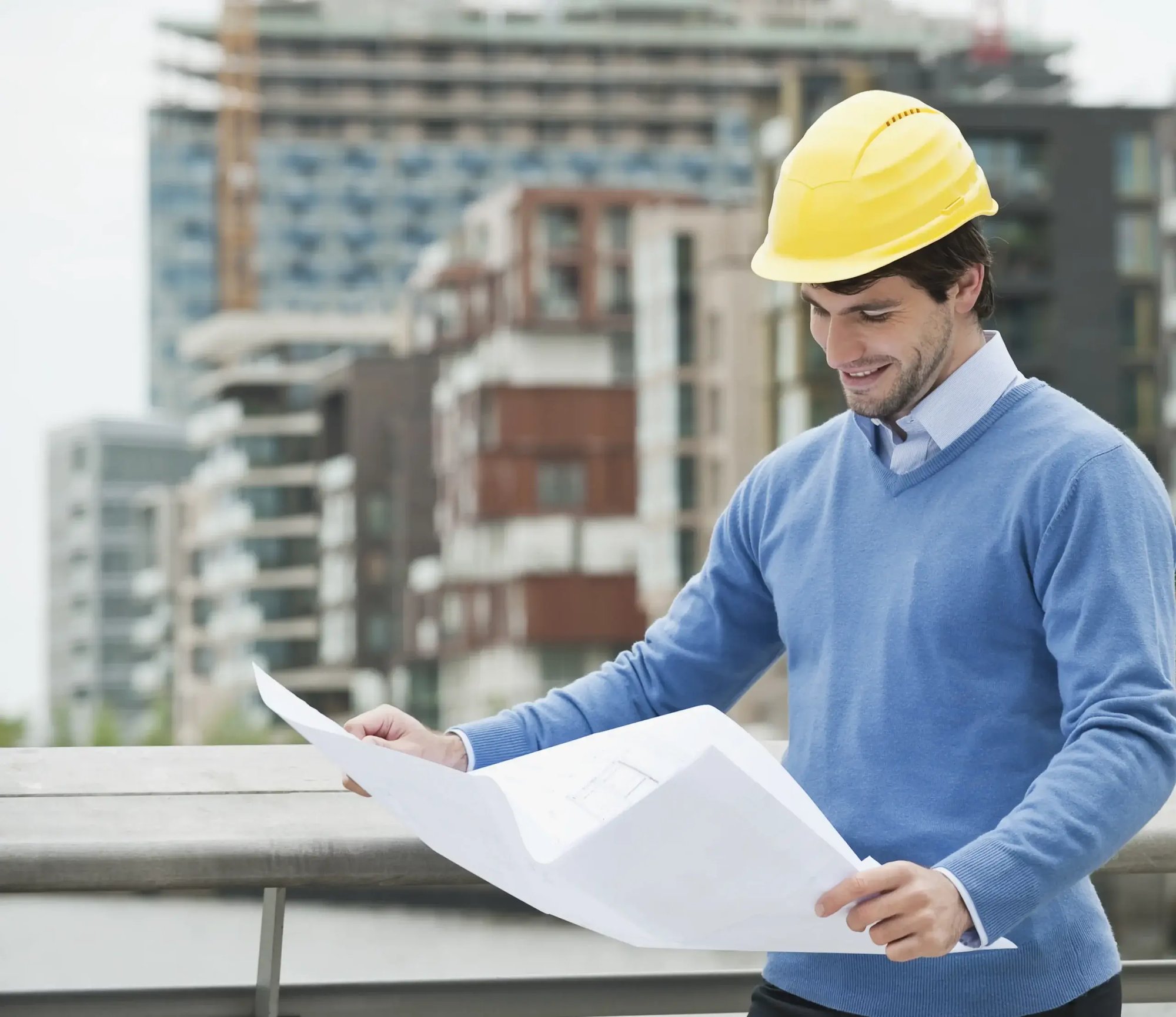 germany-hamburg-businessman-with-blueprint-smil-2022-12-16-22-40-50-utc-scaled germany-hamburg-businessman-with-blueprint-smil-2022-12-16-22-40-50-utc-scaled